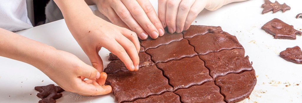 mom-kid-cut-out-dough-with-molds-cookies_117645-2784.jpeg